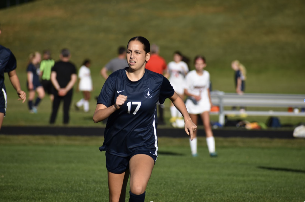 GET READY. Senior Eva Lutgen chases the ball to help out her teammates against the Minnehaha Redhawks.
